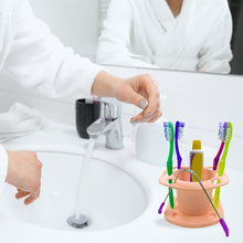 Space-efficient toothbrush and toothpaste holder.