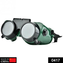 Large dark green welding goggles for protection.