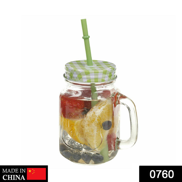 Glass mason jar with straw and handle, perfect for stylish drink presentation.