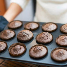 Detailed view of the muffin tray with 12 cavities, highlighting the nonstick finish and sturdy design