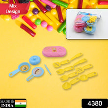 plastic play kitchen set including knife and cooking tools.